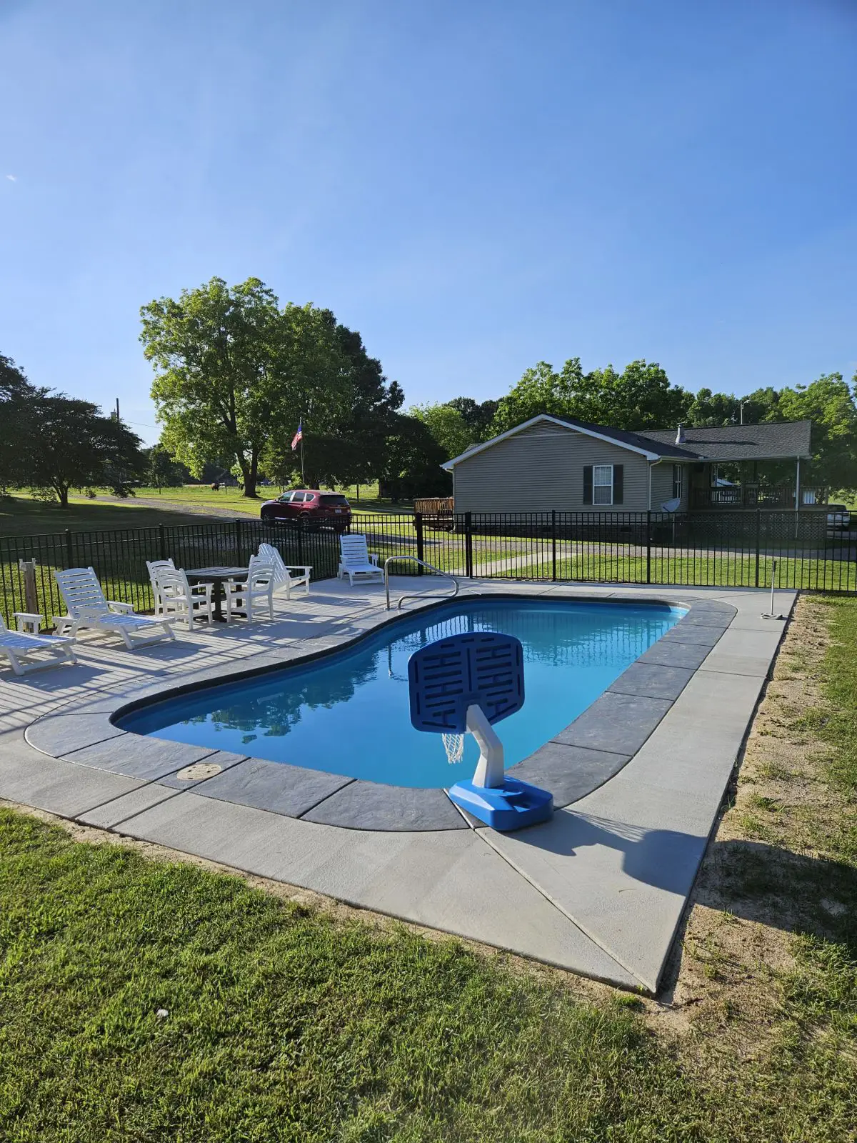 North Carolina Custom Pools Gallery: pool with basketball hoop in a residential backyard