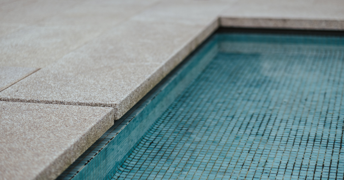 Photo of the edge of a swimming pool.