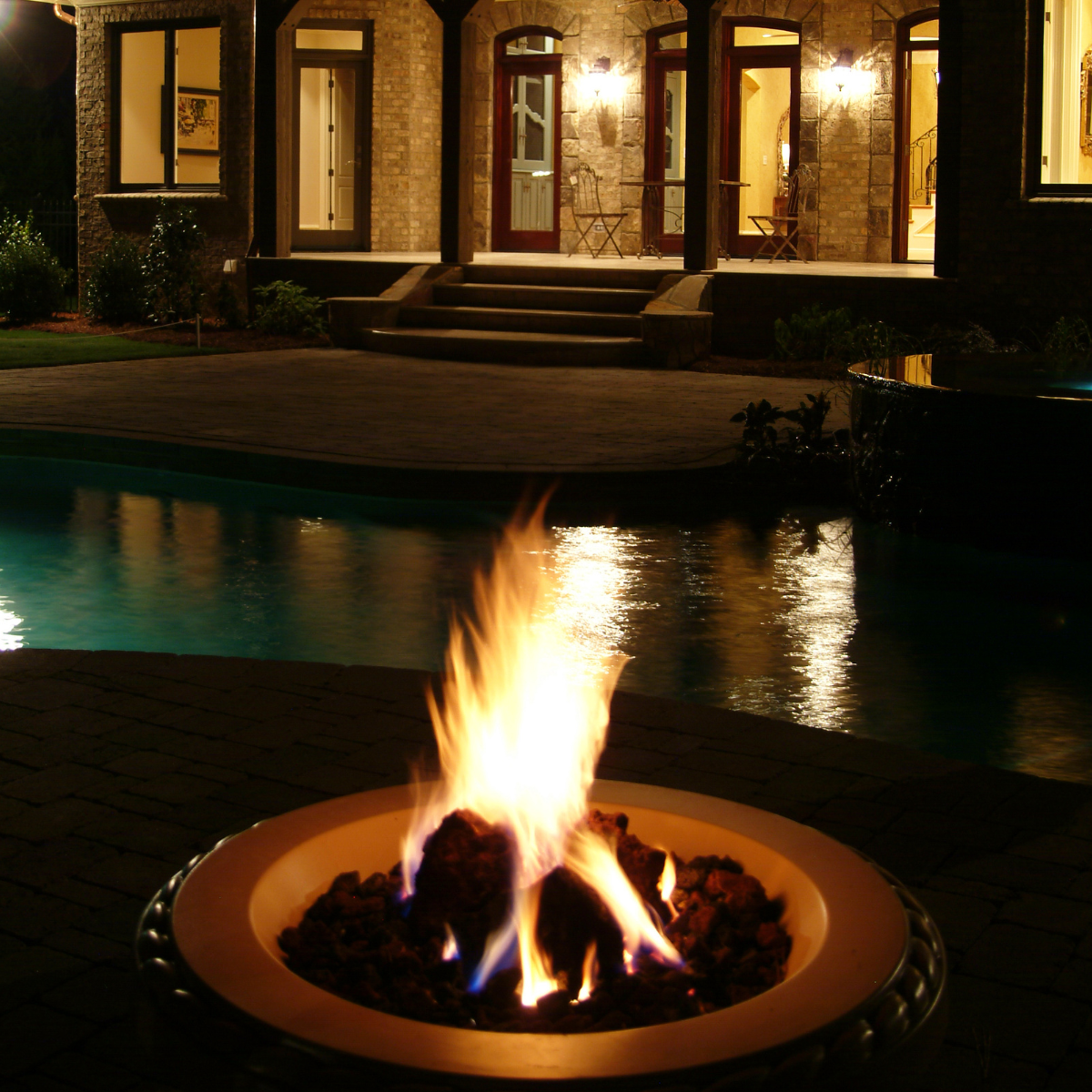 57 custom built fireplace in front of custom built pool in NC